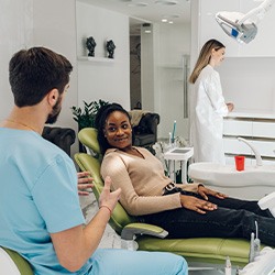 Patient in Hingham talking to dentist about dental crowns